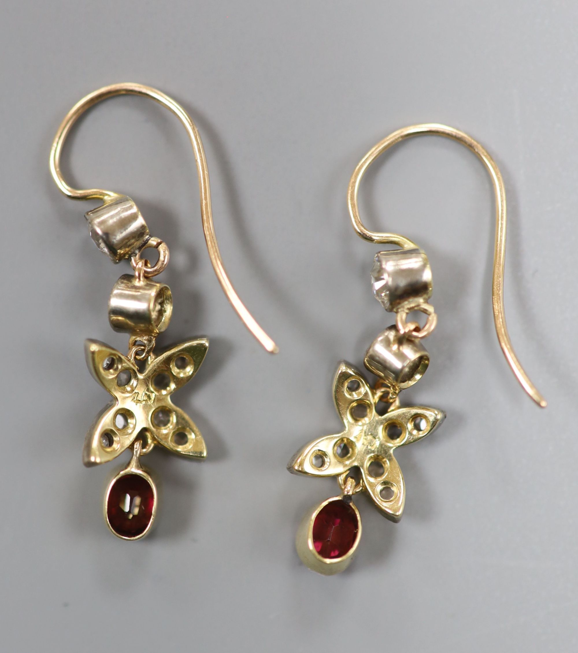 A pair of Victorian yellow and white metal, garnet and round and rose cut diamond set drop earrings, 29mm, gross 2.2 grams.